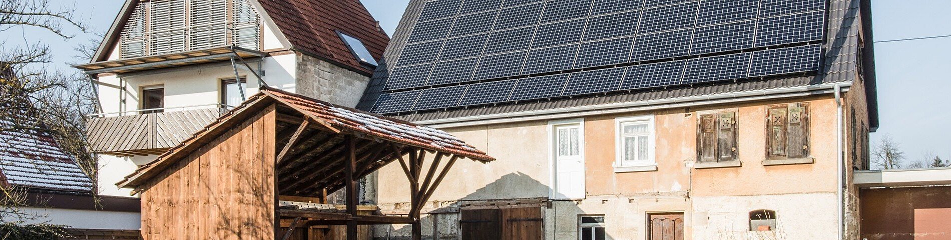 536889911 Solar panels on new roof of old farmouse house renovation
